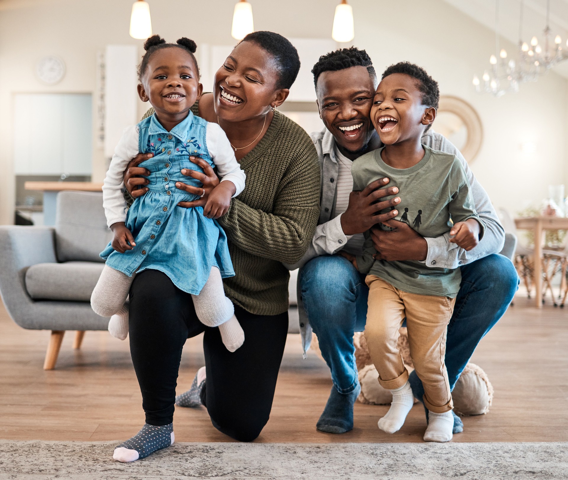 Portrait of a happy young family spending quality time at home
